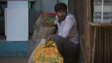 Задник к фильму "குடும்பஸ்தன்" #1167978